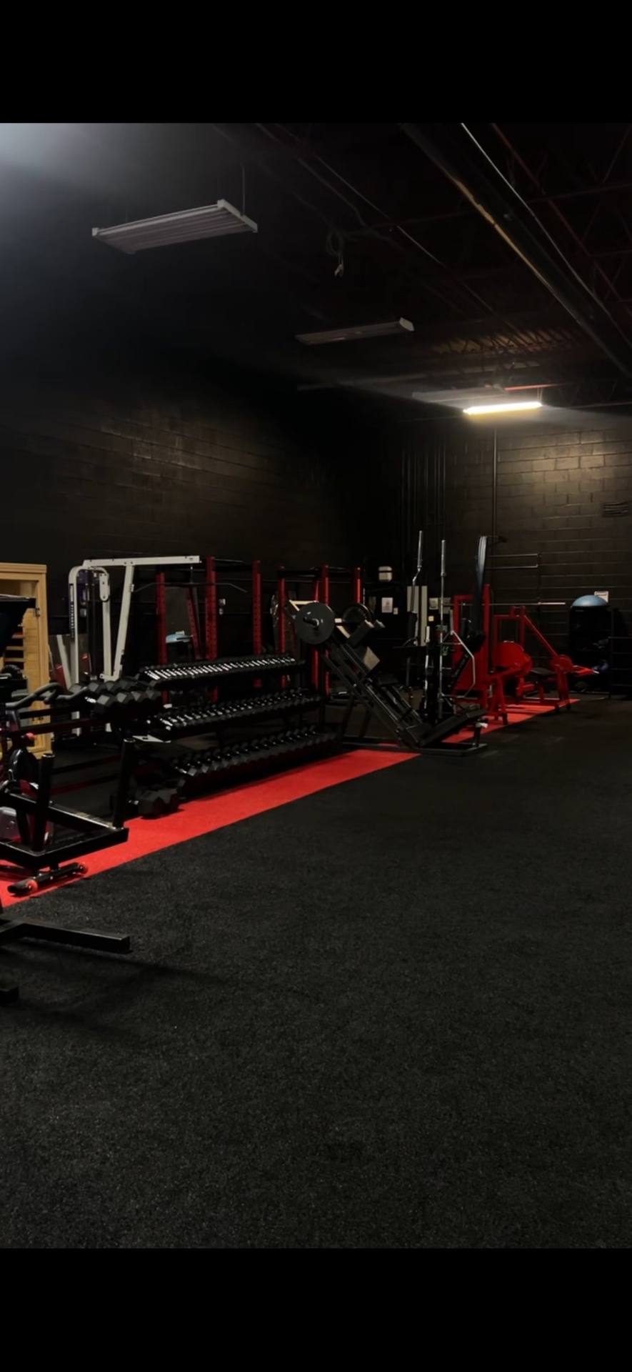 Full dumbbell rack on red turf at 3G Fitness